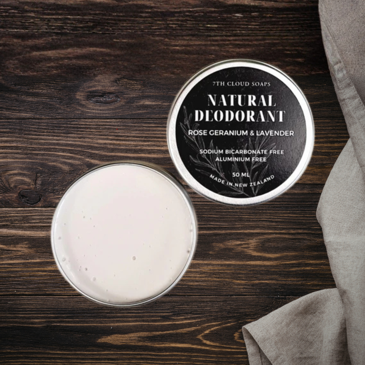 Natural deodorant in a tin with a label on a wooden surface
