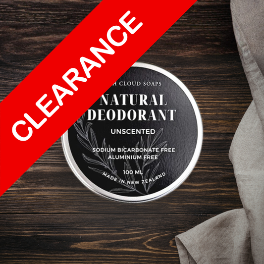 Natural deodorant container on a wooden surface with 'Clearance' label.