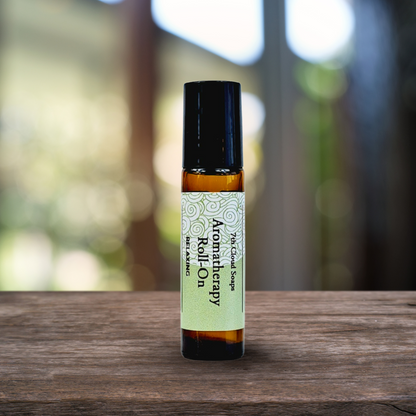 Aromatherapy roll-on bottle on a wooden surface with a blurred natural background