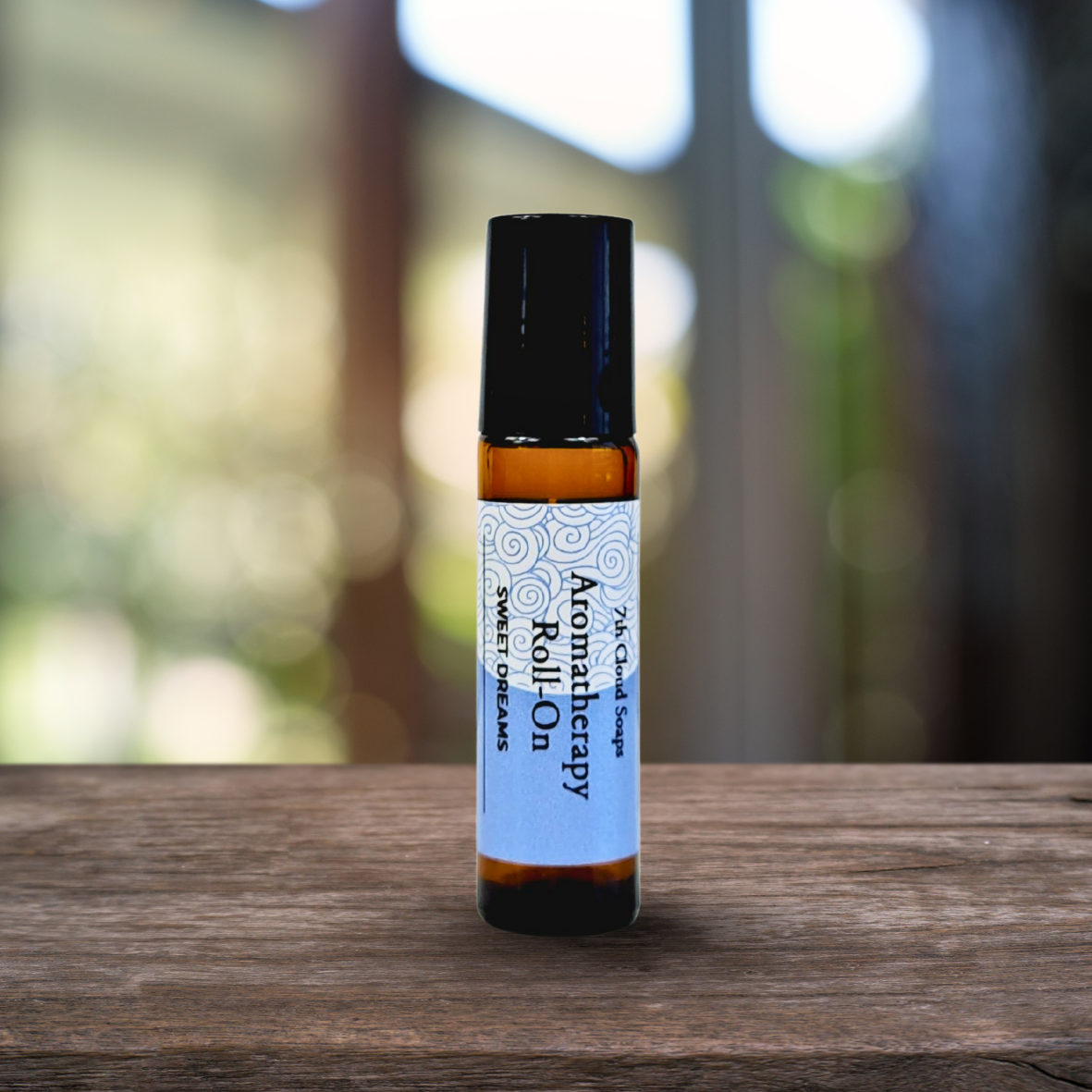 Aromatherapy roll-on bottle on a wooden surface with a blurred natural background