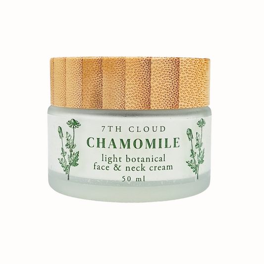 A frosted glass jar with a bamboo lid labeled '7th Cloud Chamomile Light Botanical Face & Neck Cream 50ml'.