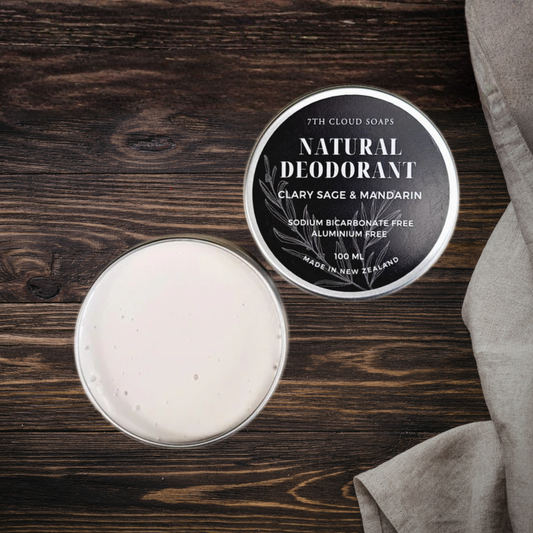 Natural deodorant in a tin with a label on a wooden surface