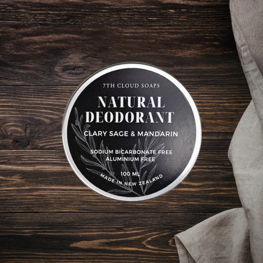7th Cloud Soaps natural deodorant container on a wooden surface