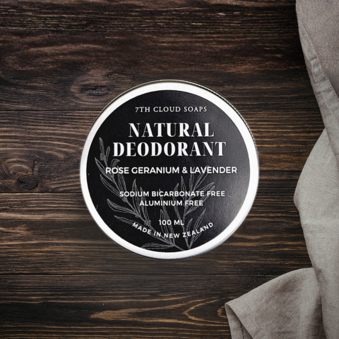 7th Cloud Soaps natural deodorant on a wooden surface