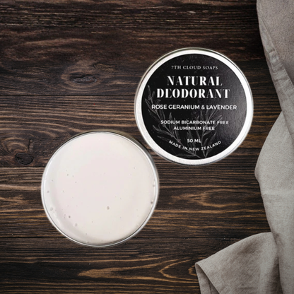 Natural deodorant in a tin with a label on a wooden surface