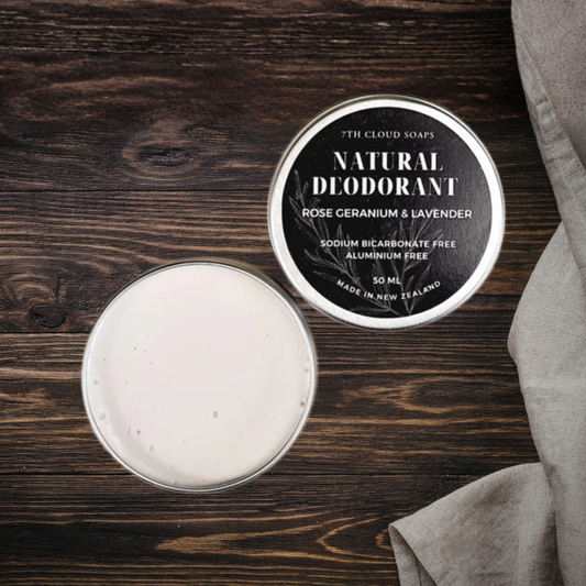 Natural deodorant in a tin with a label on a wooden surface
