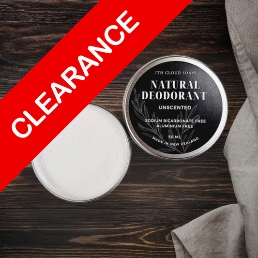 Natural deodorant container with 'Clearance' label on a wooden surface